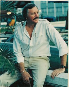 Ron Yates sitting on a wall
